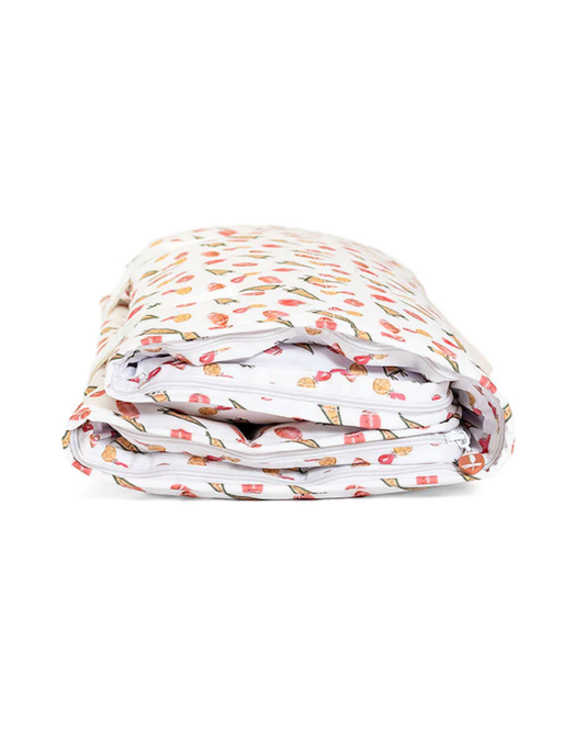 TRVL Nap Mat - Touchdown, folded design featuring wipeable, antimicrobial exterior with fun print.