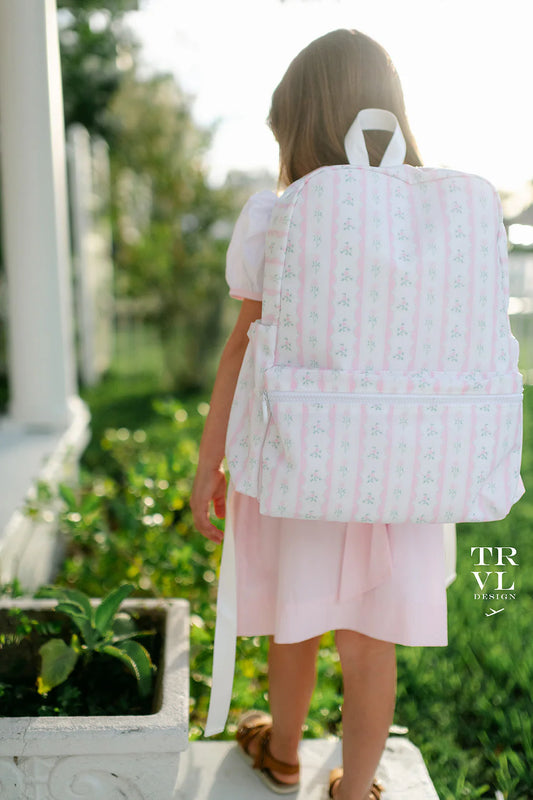 Child wearing TRVL Backpack outdoors