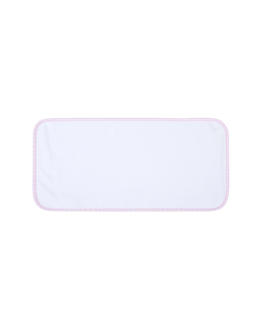 Magnolia Baby Minicheck Trim Burp Cloth in white with pink minicheck trim, perfect for feeding and spills.